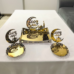 Decorative set with laser-cut designs on a white surface