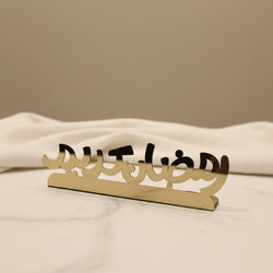 Metallic decorative item on a marble surface